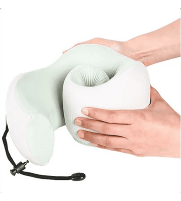 CHOOKLY ergonomic memory foam travel neck pillow being folded by hands, showing flexible slow-rebound foam design and adjustable strap for comfortable neck support during flights and travel